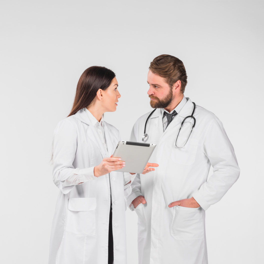 Two physicians communicate while holding a patient chart.