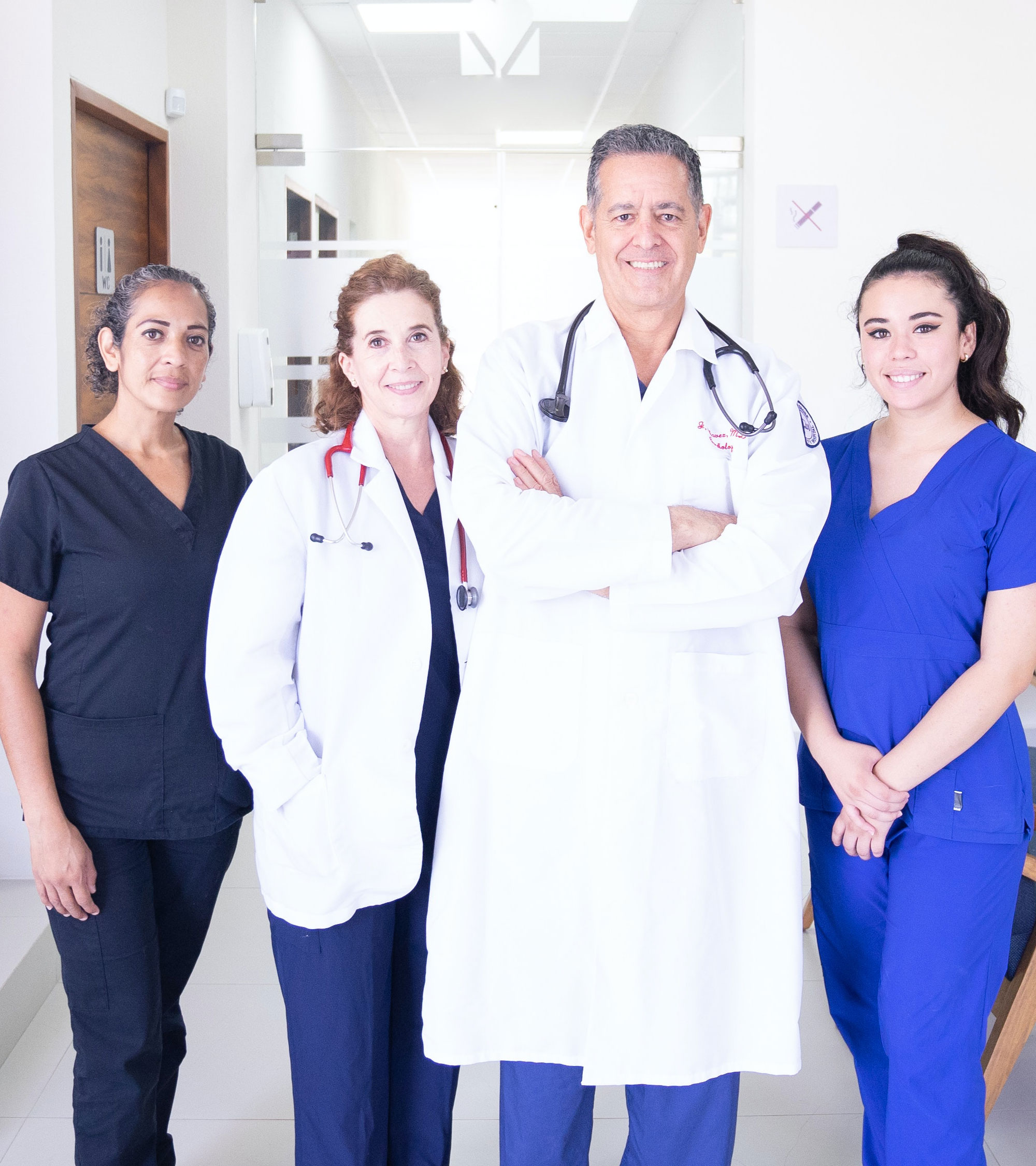 Smiling group of four clinical staff members.